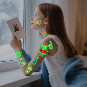 Luminous Christmas tattoo stickers for kids featuring Santa Claus and reindeer on a girl