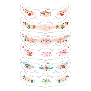 Cute Christmas facial tattoo stickers set with festive cartoon reindeer and gingerbread man