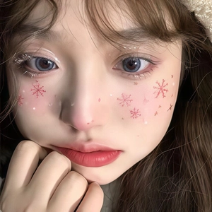 Christmas snowflake face stickers with glitter silver eyelashes for festive winter makeup