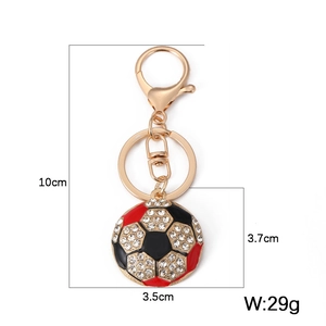 Detail view of rhinestone soccer keychain with size dimensions 10cm length and 29g weight