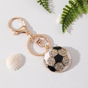 Sparkling rhinestone soccer keychain with golden lobster clasp on elegant white background