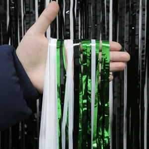 Soccer themed fringe curtain in green white and black for party backdrop decorations