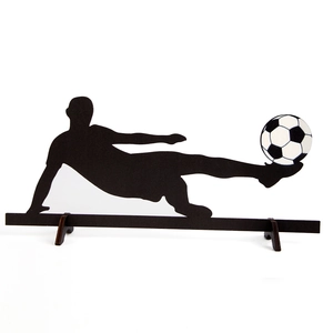 Wooden silhouette tabletop ornament featuring a soccer player kicking a classic football