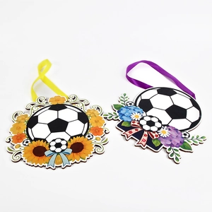 Detail view of two soccer-themed door hangers with sunflowers, ribbons and green leaves