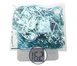 Detailed view of light blue shiny tinsel wig decoration weighing 16.2g on a scale
