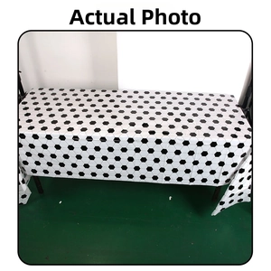 Detail of disposable soccer themed tablecloth with classic black and white football pattern