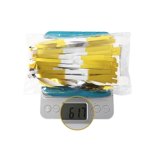 Detail view of 40cm gold and silver tinsel curtain weighing 61.7g in retail packaging