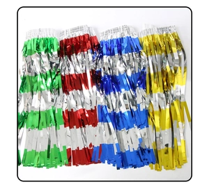 Detail of colorful metallic foil fringe curtains in green red blue and gold for party decor