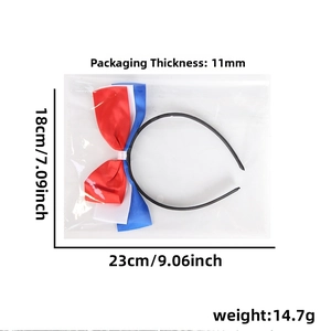 Detail view of USA flag colored bow headband with exact size measurements in packaging