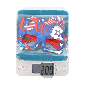 Close-up of lightweight USA flag theme party glasses weighing exactly 20 grams on a digital scale