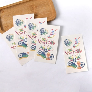 Close-up of 5-pack football temporary tattoos with victory and trophy designs