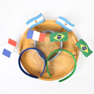 Detailopname van drie sprankelende vlag-haardoppen van Argentinië Brazilië en Frankrijk
