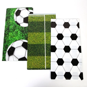 Three-piece set of football themed tablecovers featuring grass pitch and ball patterns