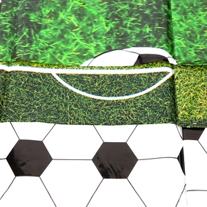 Detailed view of waterproof PE soccer tablecloth featuring green grass and football patterns