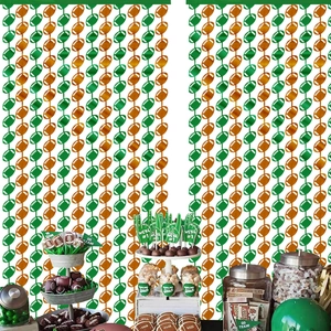 Detail of green and orange American football foil fringe curtain for party backdrops