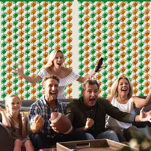 Macro detail of green and gold football tinsel curtain for sports themed party decorations