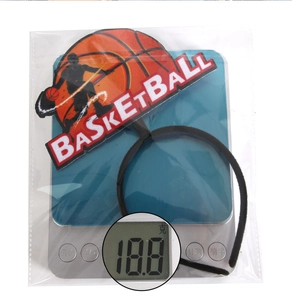 Detail showing basketball theme headband weight at 18.8g on a digital scale