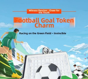 Close-up of metal football goal token keychain with black and white soccer ball pattern