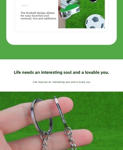 Close-up of metal football keychain with removable ball charm and green turf base detail