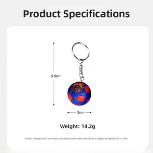Close-up of a 3cm soccer ball keychain featuring a red and blue FCB club logo