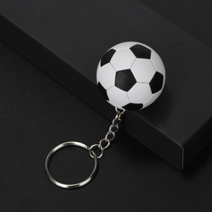 Detailed macro view of the realistic mini soccer ball keychain with metallic ring