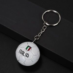 Macro detail of Italy football keychain featuring white ball with Italia shield logo