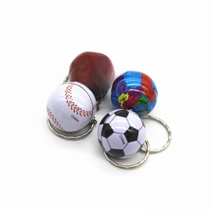 Detailed close-up of mini sports ball keychains including soccer, basketball, and baseball