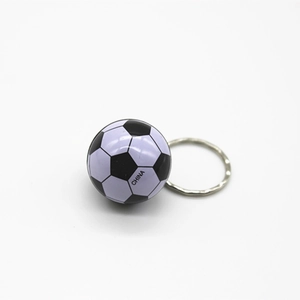 Detailed view of a black and white mini soccer keychain with CHINA text and metal ring