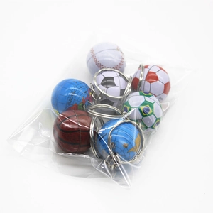 Close-up of sports ball keychains in a transparent bag including football and basketball
