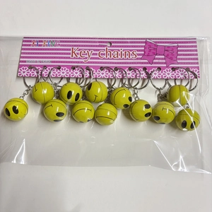 Set of 12 yellow smiley face ball keychains with silver metal rings in retail packaging