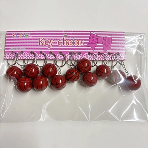 Set of 12 basketball keychains with textured brown balls on retail card packaging