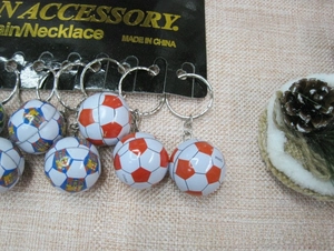 Detailed view of FC Barcelona logo football keychains with silver metal rings