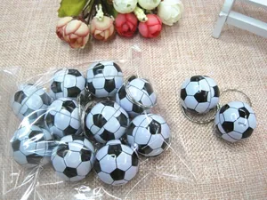 Bulk set of mini black and white soccer ball keychains with silver metal rings