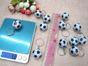 Close-up of mini black and white soccer keychain with metal ring weighing 5.0g