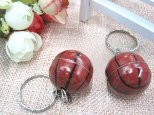 Detailed view of red-brown basketball keychain with realistic texture and silver ring