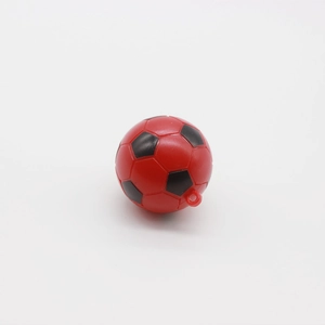 Detailed view of mini red and black soccer ball pendant with integrated hanging ring loop