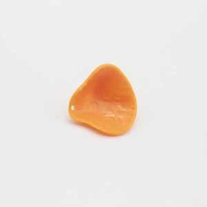 Close-up of orange silicone protective sleeve with small hanging hole and matte finish