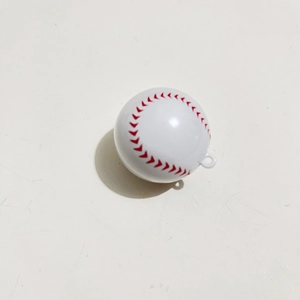 Detail of white baseball keychain pendant with red stitching and integrated hanging loop