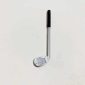 Detailed view of a miniature golf club accessory with metallic finish and black handle grip