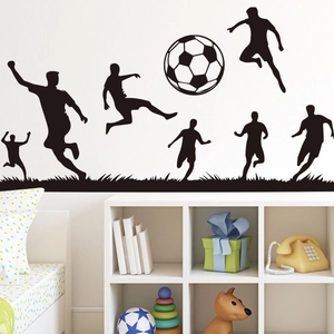 Detail of soccer player silhouette wall stickers in a kids room soccer themed decor