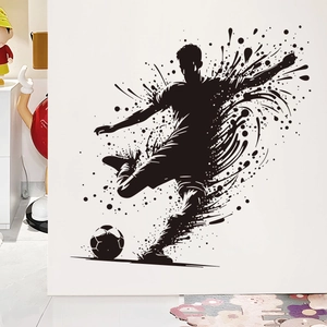 Artistic black splatter football player wall sticker showing dynamic soccer kick motion