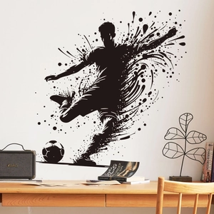 Detailed view of soccer player silhouette wall sticker on white interior wall
