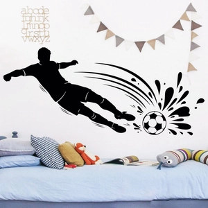 Detailed view of black football player silhouette wall sticker with splash soccer design