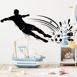 Detail of soccer player silhouette wall decal in a kid's room with creative ink splash design
