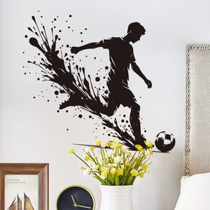 Macro detail of black soccer player silhouette wall sticker with ink splash effects