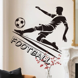 Detail of 3D football player silhouette wall sticker on white wall near fireplace