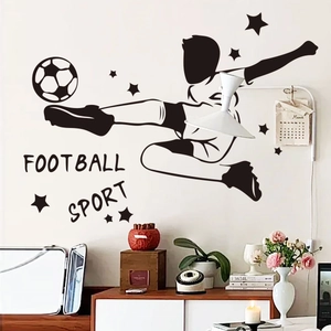 Wall decal detail showing a soccer player silhouette with stars and football lettering