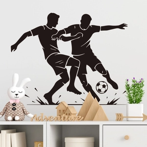 Detail of black soccer players silhouette wall sticker in a modern room setting
