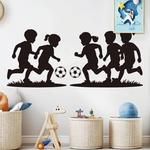 Soccer silhouette wall stickers showing kids playing football in a modern nursery room