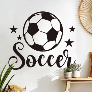 Detail view of soccer wall sticker with black and white ball and stars on white wall